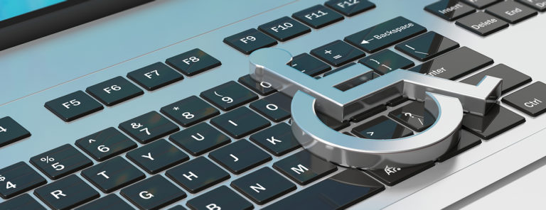 Technology for disabled. Wheelchair sign on computer laptop keyboard, banner. 3d illustration